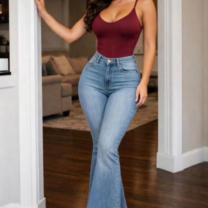 High-waisted, medium-wash flared denim jeans.